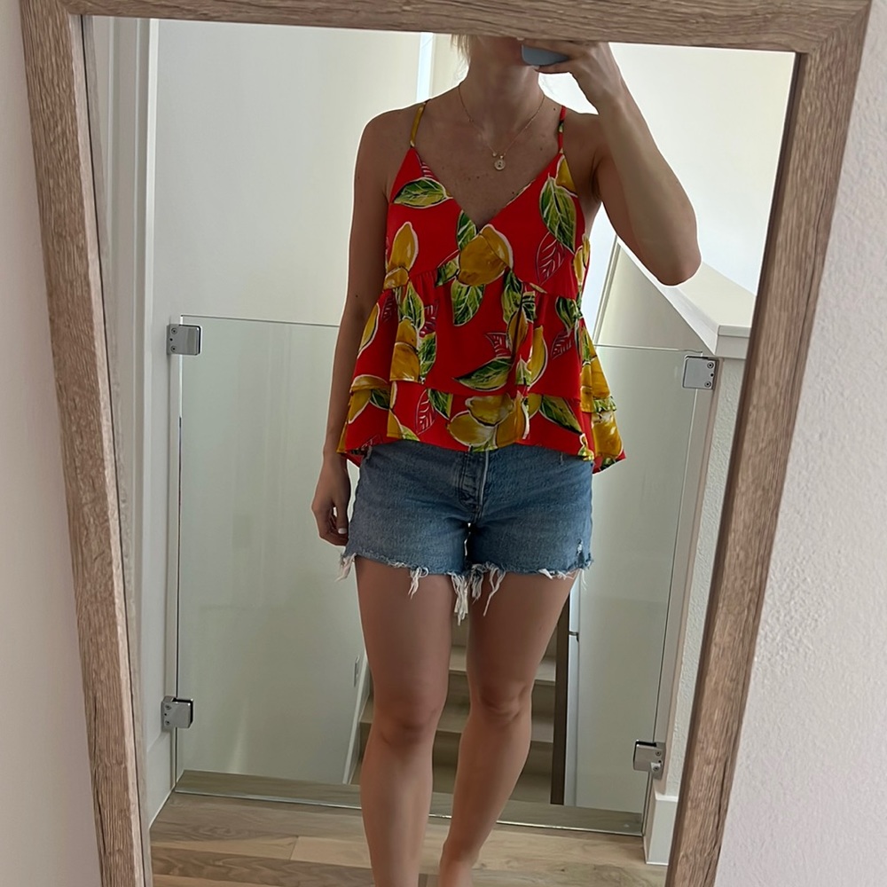 Red flowy/ruffled tank with lemon print. NWOT never worn!! Size S-M.